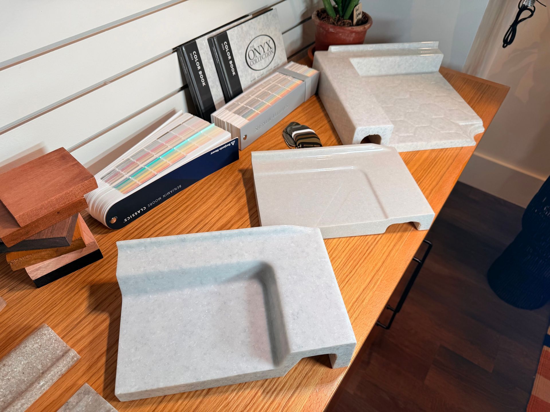 Samples of Onyx Collection Shower Base Options at the Ekon Bath Showroom.