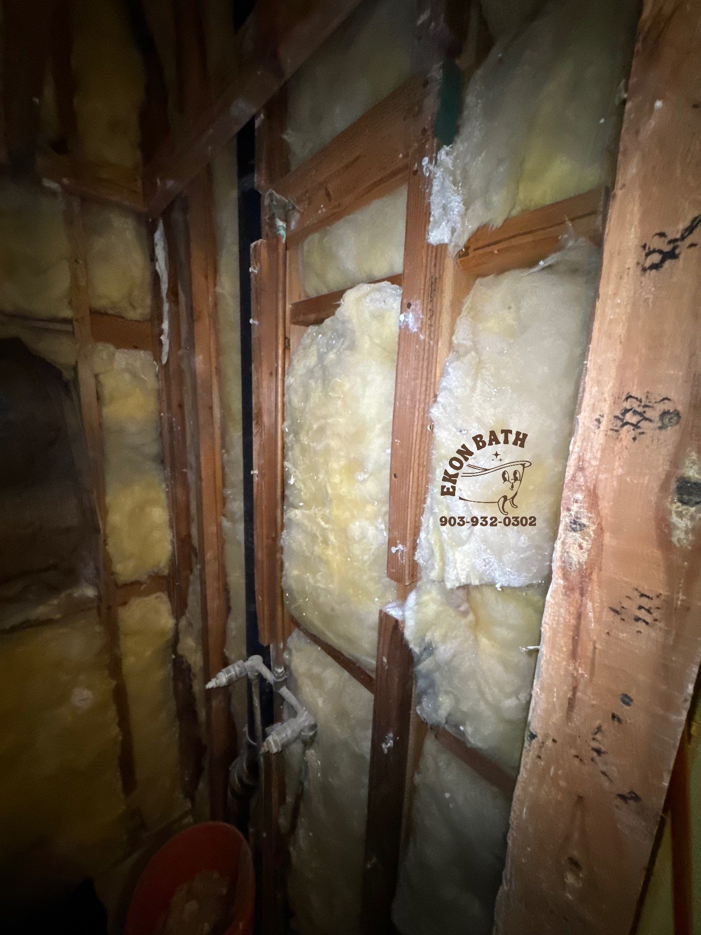A bathroom with a lot of insulation on the walls.