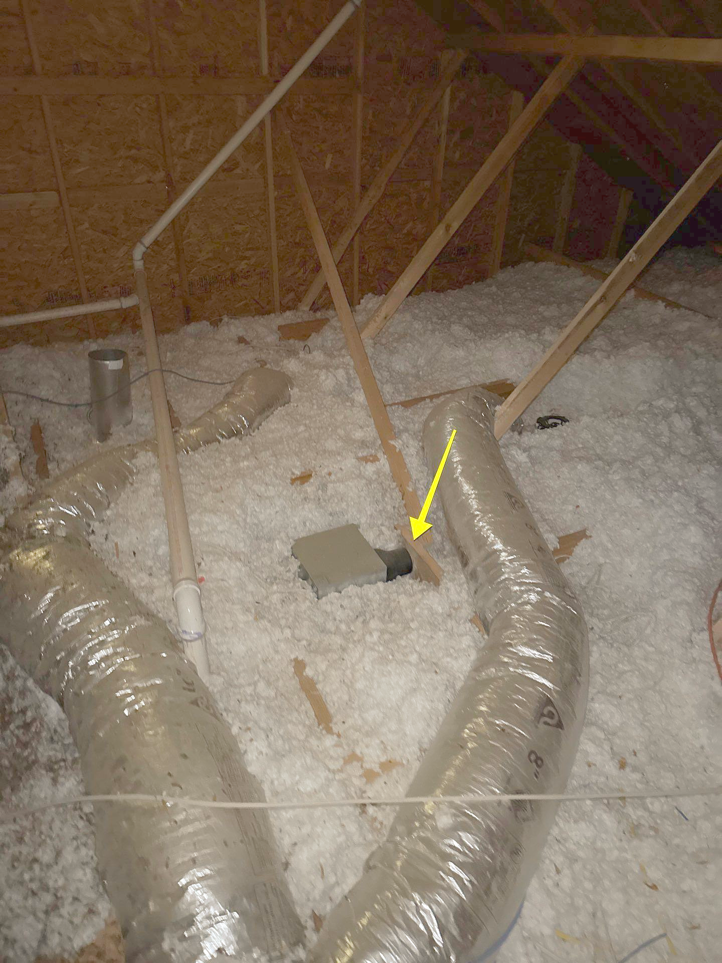 A bathroom ventilation fan installed incorrectly and with no proper ventilation.