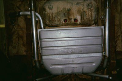 Header Rust Repair Services — Rusted Muffler Close-Up in Bakersfield, CA