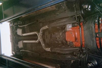 Customizable Muffler Services — Glossy Red Car Front in Bakersfield, CA