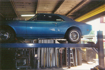 Service Muffler and Exhaust — Blue Car Side View in Bakersfield, CA