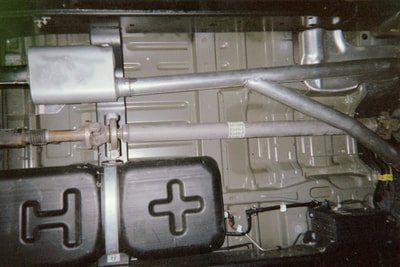 Custom Exhaust Service — Red Pick-Up Exhaust System in Bakersfield, CA