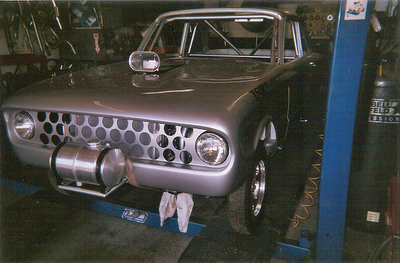 Custom Mufflers — Front Bumper of Grey  Vintage Car in Bakersfield, CA