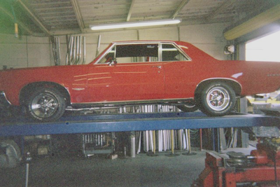 Personalized Services — Red Vintage Car Side View in Bakersfield, CA