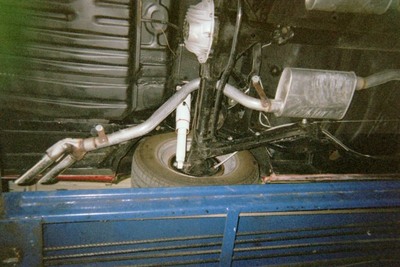 Muffler Service — Undercarriage Axis and Wheel Close-up  in Bakersfield, CA