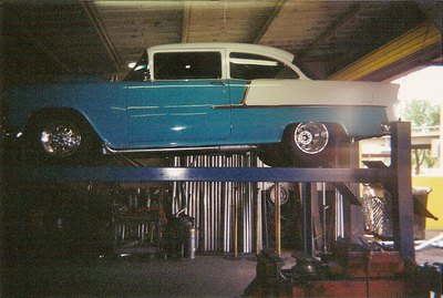 Exhaust Services — Blue and White Colored Car in Bakersfield, CA