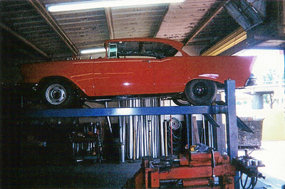 Customize Muffler Service — Lowered Red Colored Car in Bakersfield, CA