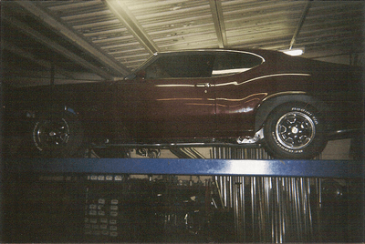 Custom Exhaust Service — Dark Brown Car Side View in Bakersfield, CA