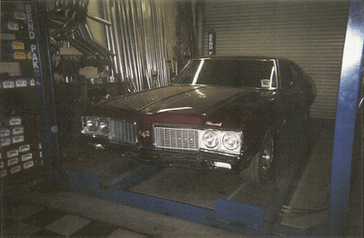 Custom Exhaust Services — Dark Brown Car Front Side View in Bakersfield, CA