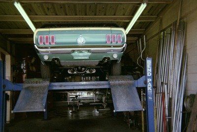 Custom Exhaust Services — Green Vintage Car Rear View in Bakersfield, CA