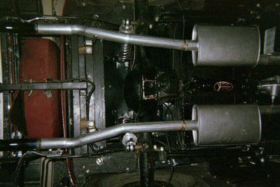 Exhaust Services — Red Classic Car Muffler Closed-Up in Bakersfield, CA