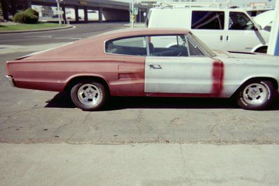 Customizable Muffler Service — Red and White Colored Car Side View in Bakersfield, CA