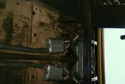 Customizable Muffler Services — Red and White Colored Car Muffler in Bakersfield, CA