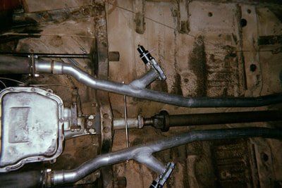 Customizable Exhaust Services — Red and White Colored Car Exhaust System in Bakersfield, CA