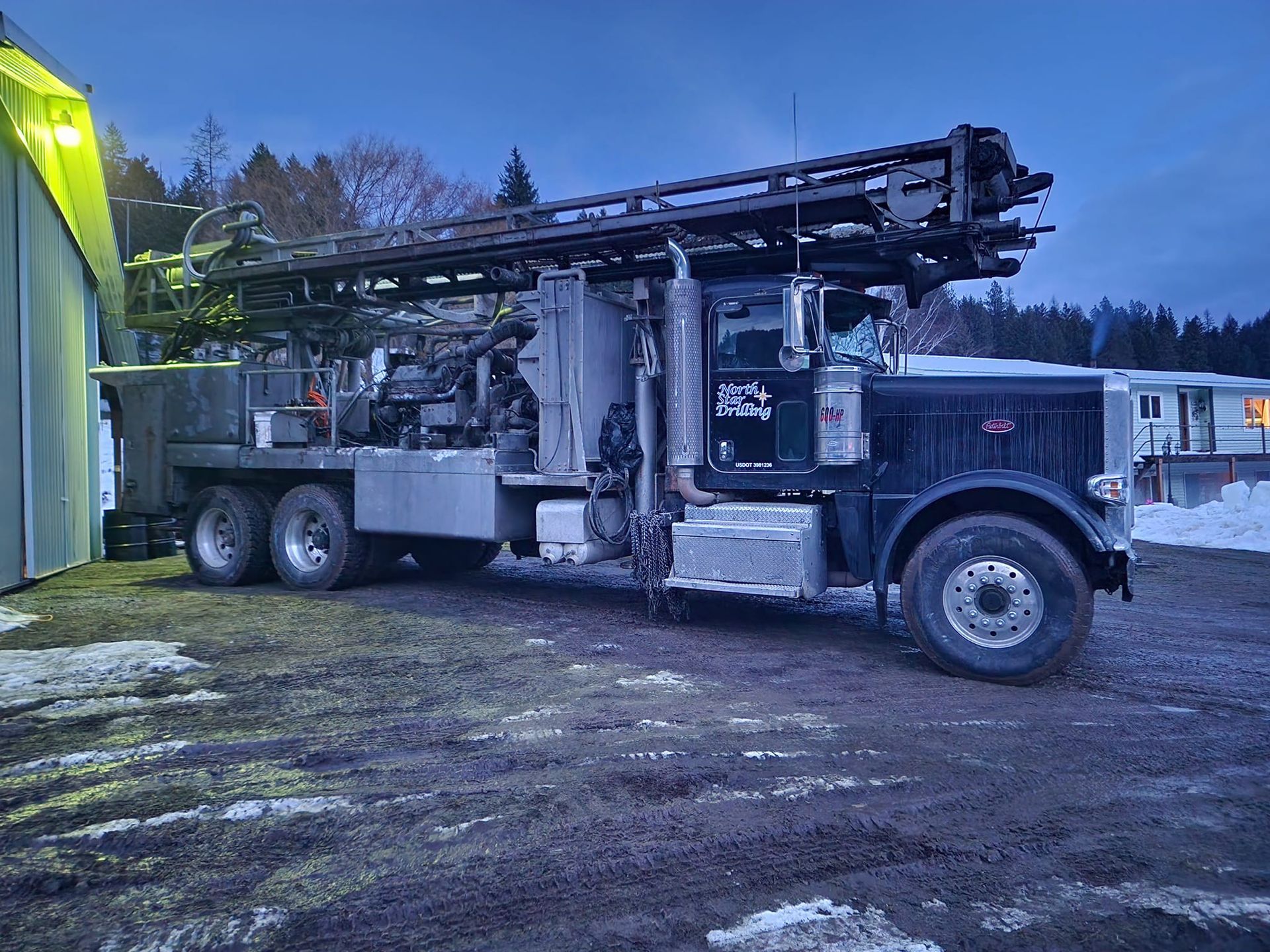A Large Truck Is Parked In Front Of A House | Thompson Falls, MT | North Star Drilling Inc.