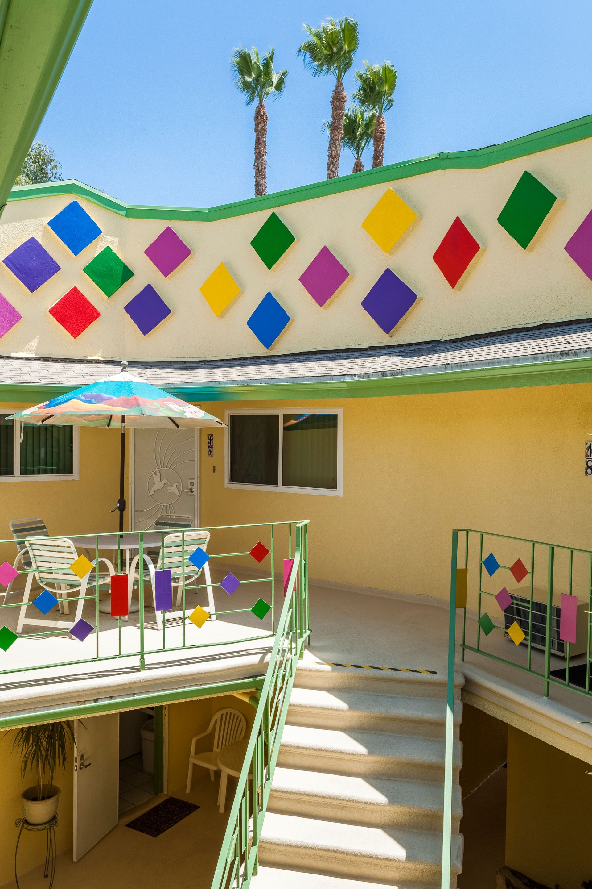 A colorful building with stairs leading up to it