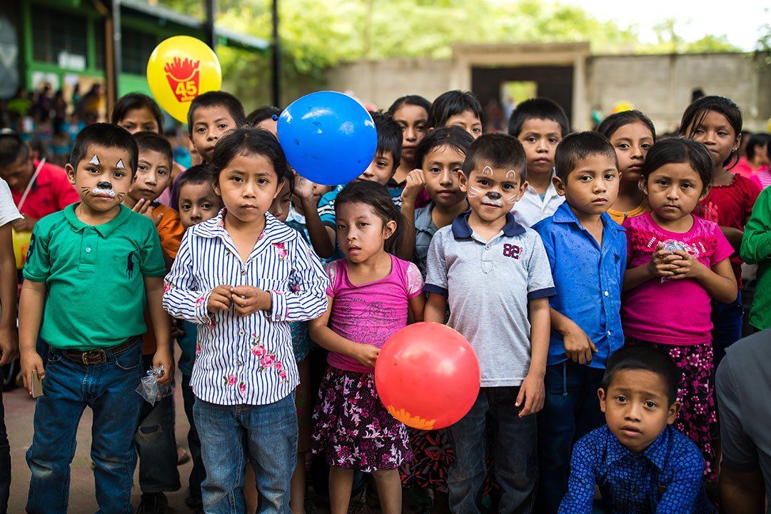 Children Holding Balloons