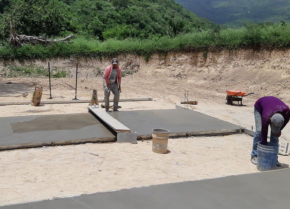 People Layering Cement