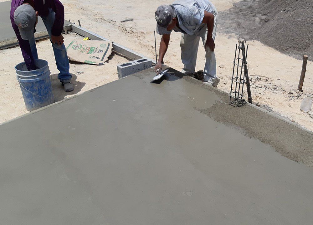People Layering Cement
