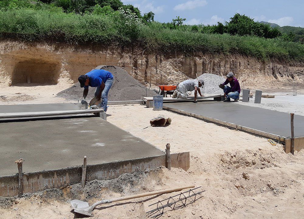 People Layering Cement