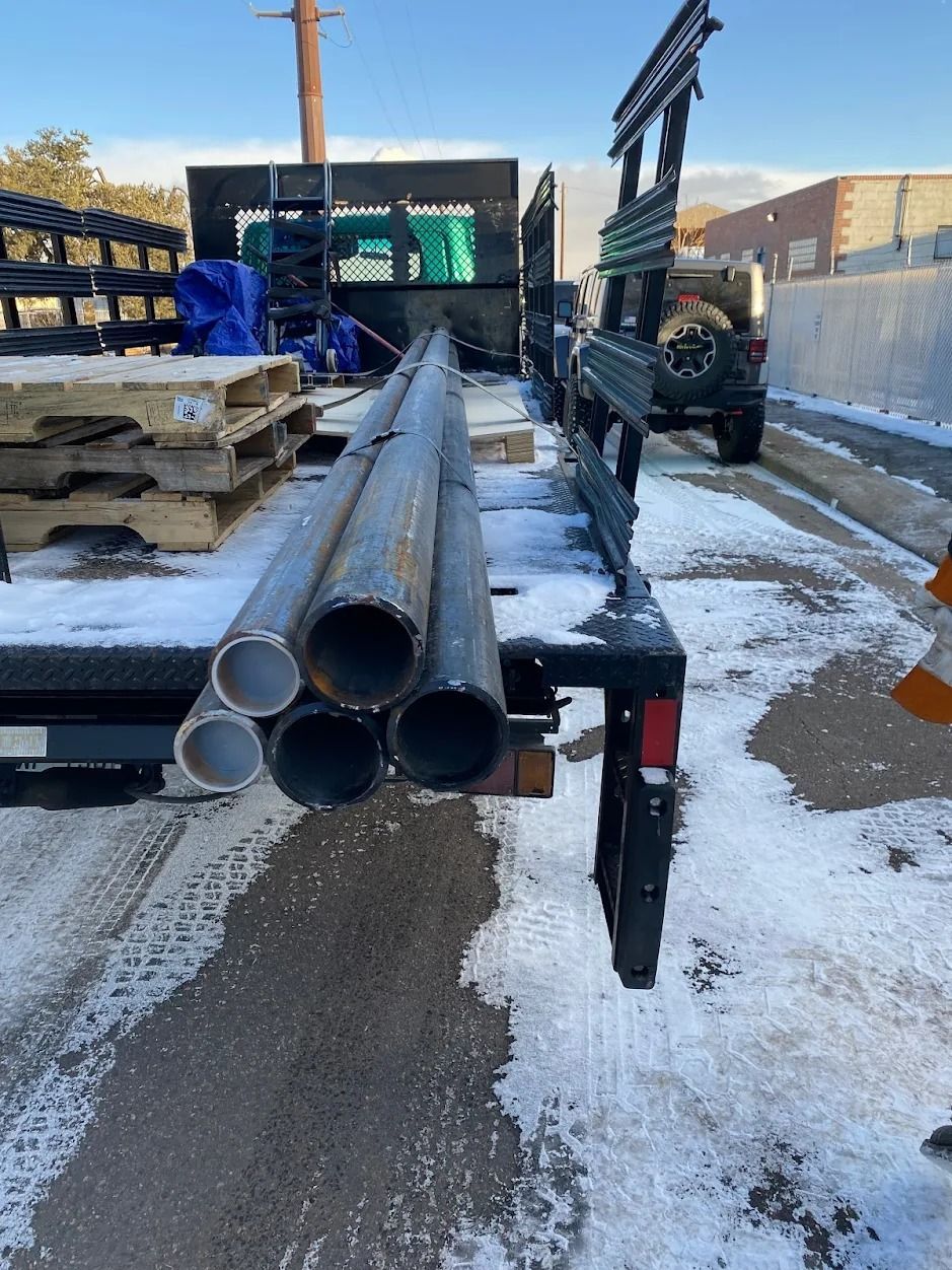 metal pipes and pallets on truck