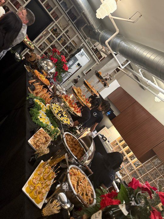 A buffet table with a lot of food on it