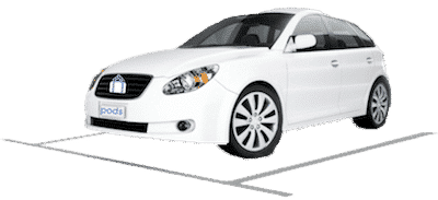 White car parked in a parking space.