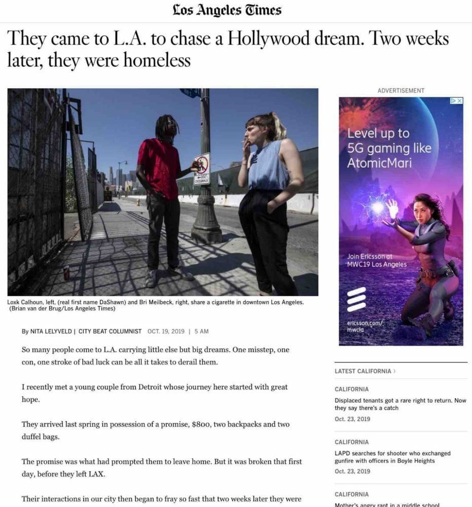 Article about homeless people in Los Angeles. Two people, one black, one white, talking near a bridge. Advert for a game on the right.