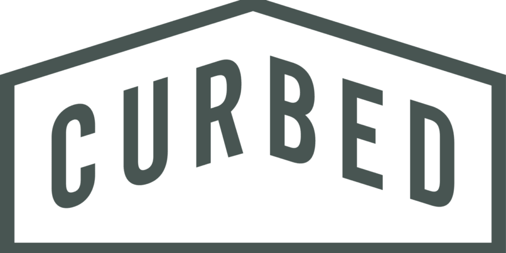 "CURBED" text within a house-shaped border. Dark gray letters and border on a white background.