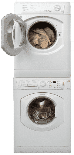 Stacked white washing machine and dryer with open door showing laundry inside.