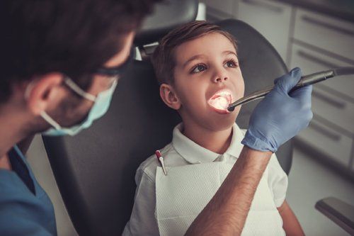 Dentist Checking Kid's Teeth