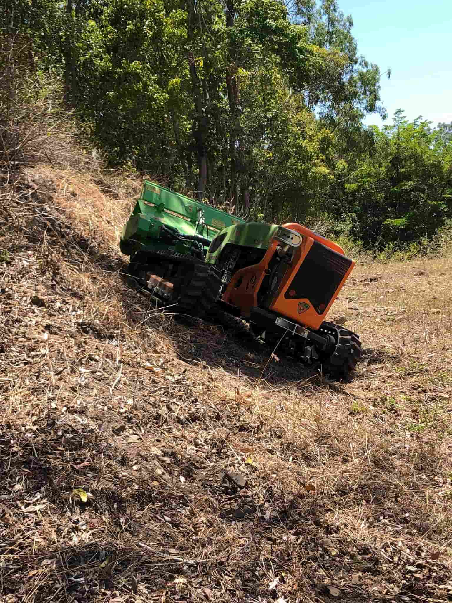 Green Climber Machine Clearing the Field — Green Clearing & Maintenance in Mackay, QLD