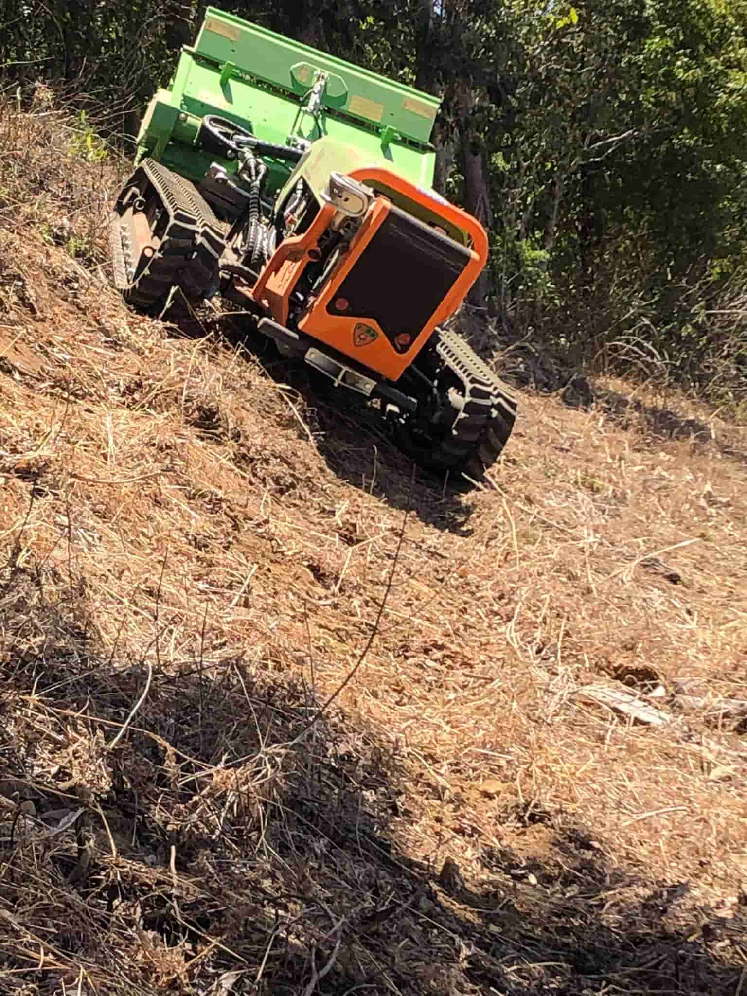 Machine in Inclined Position — Green Clearing & Maintenance in Mackay, QLD
