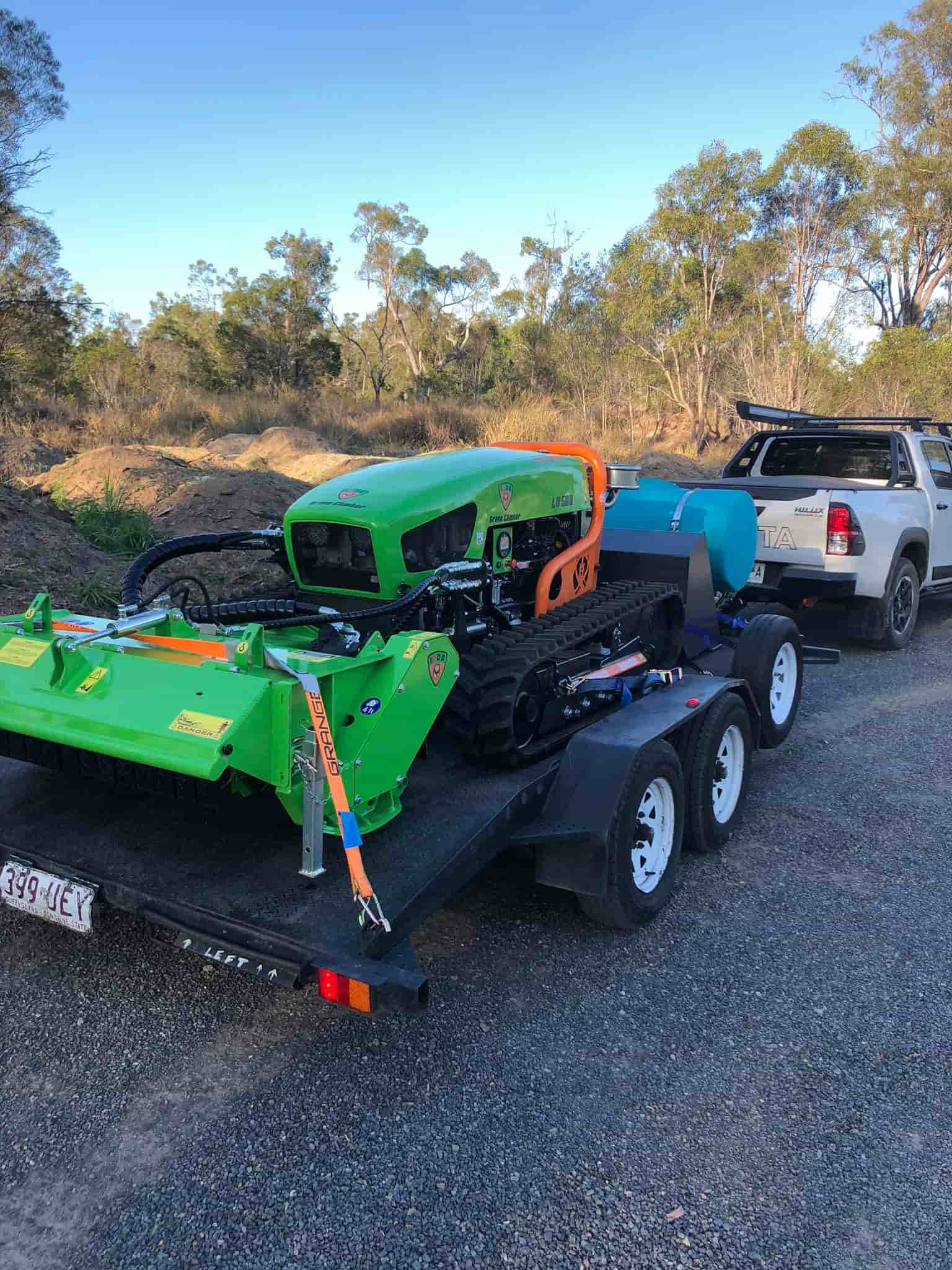 Trailer Carrying Land Clearing Machine — Green Clearing & Maintenance in Mackay, QLD