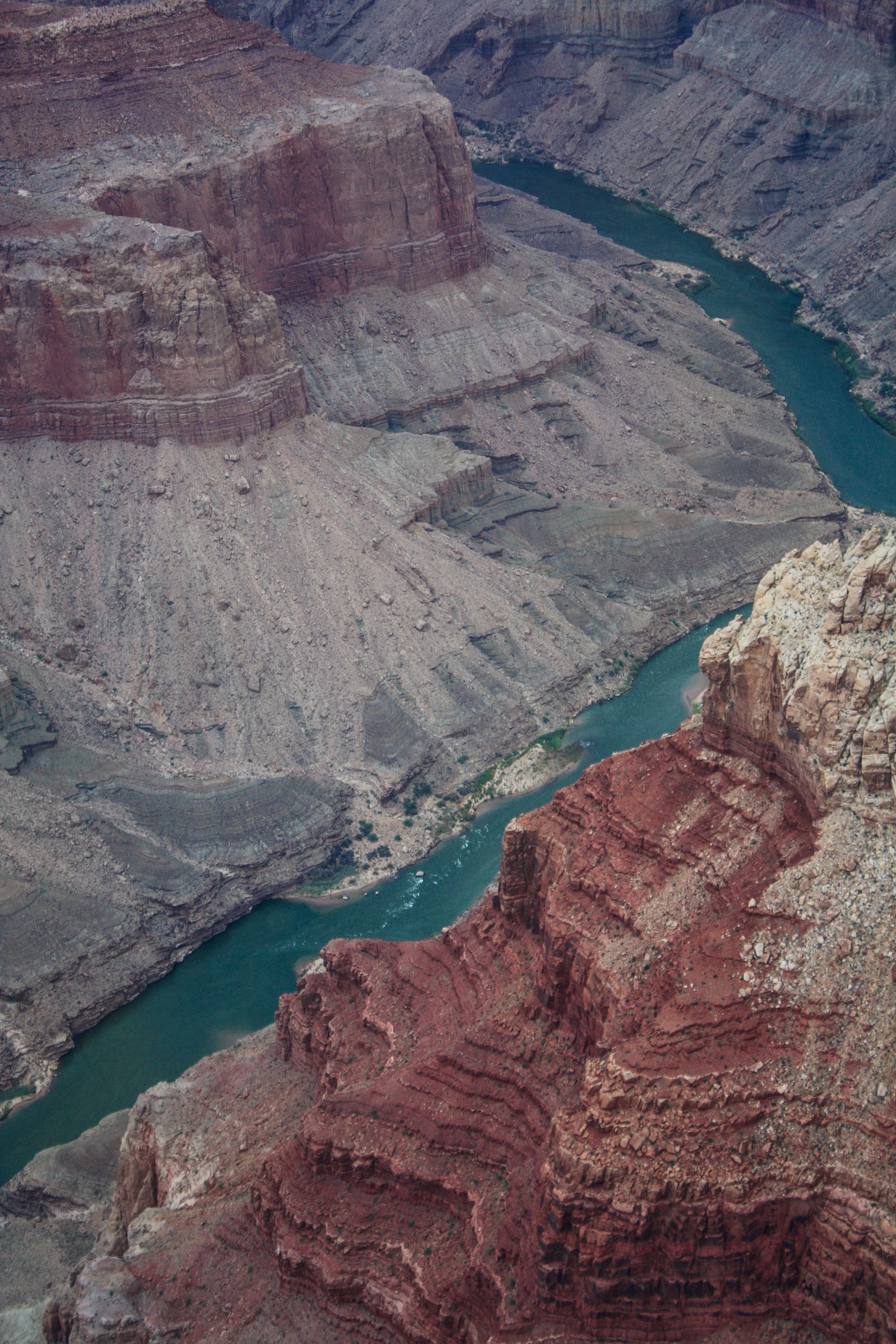 An aerial view of a river flowing through a canyon.