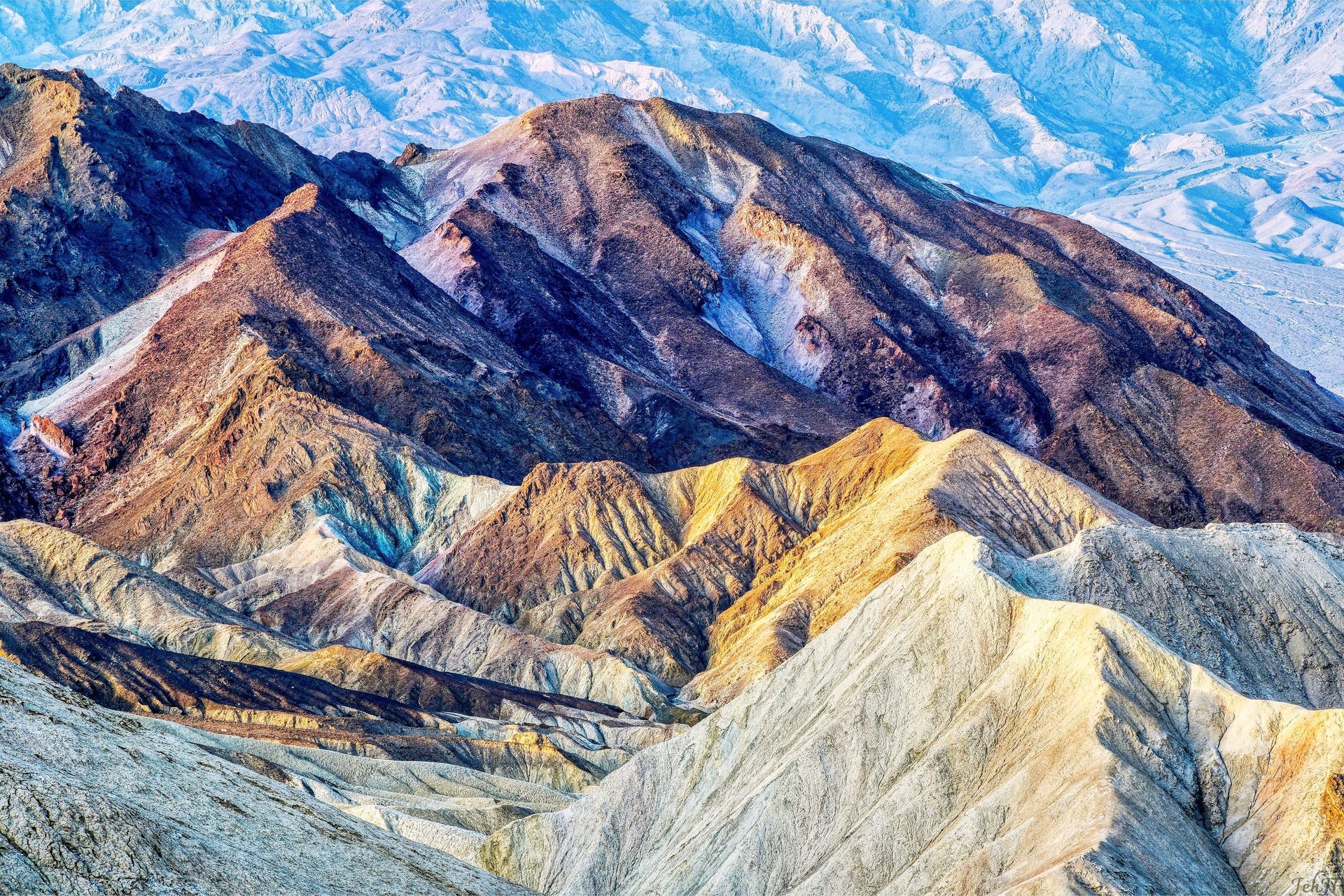 There are many different types of mountains in this picture.