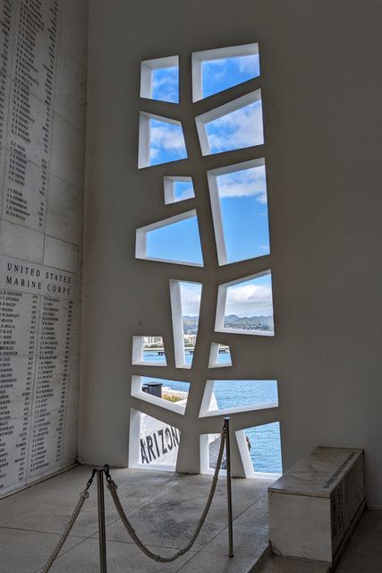 A building with a window that looks out to the ocean