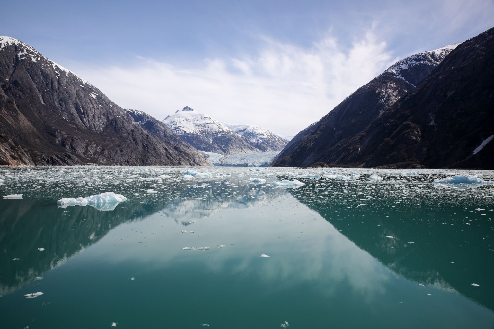A large body of water with mountains in the background