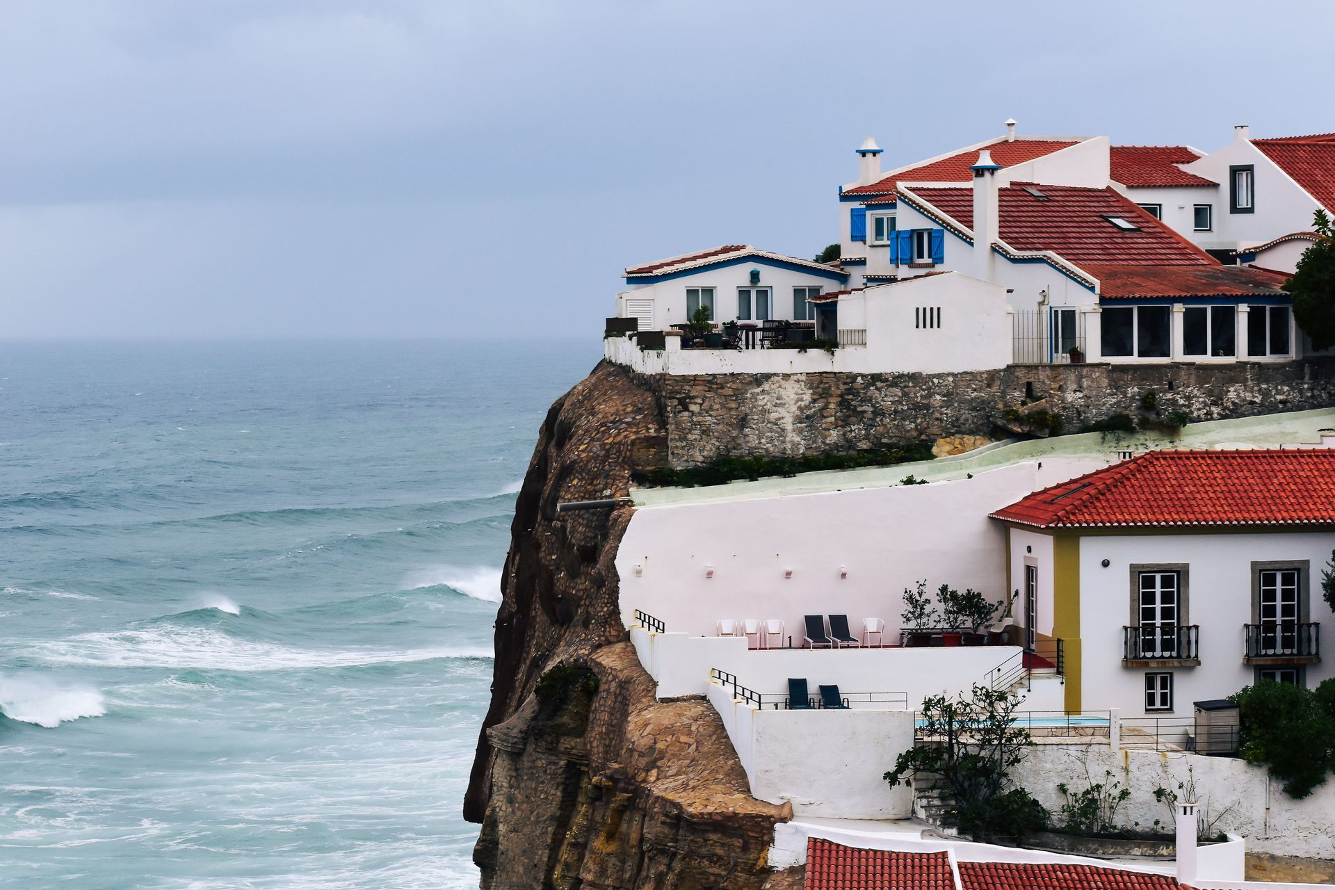 A house on a cliff overlooking the ocean