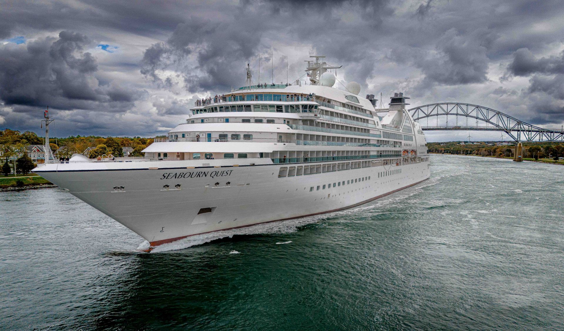 a large cruise ship is floating on top of a body of water .