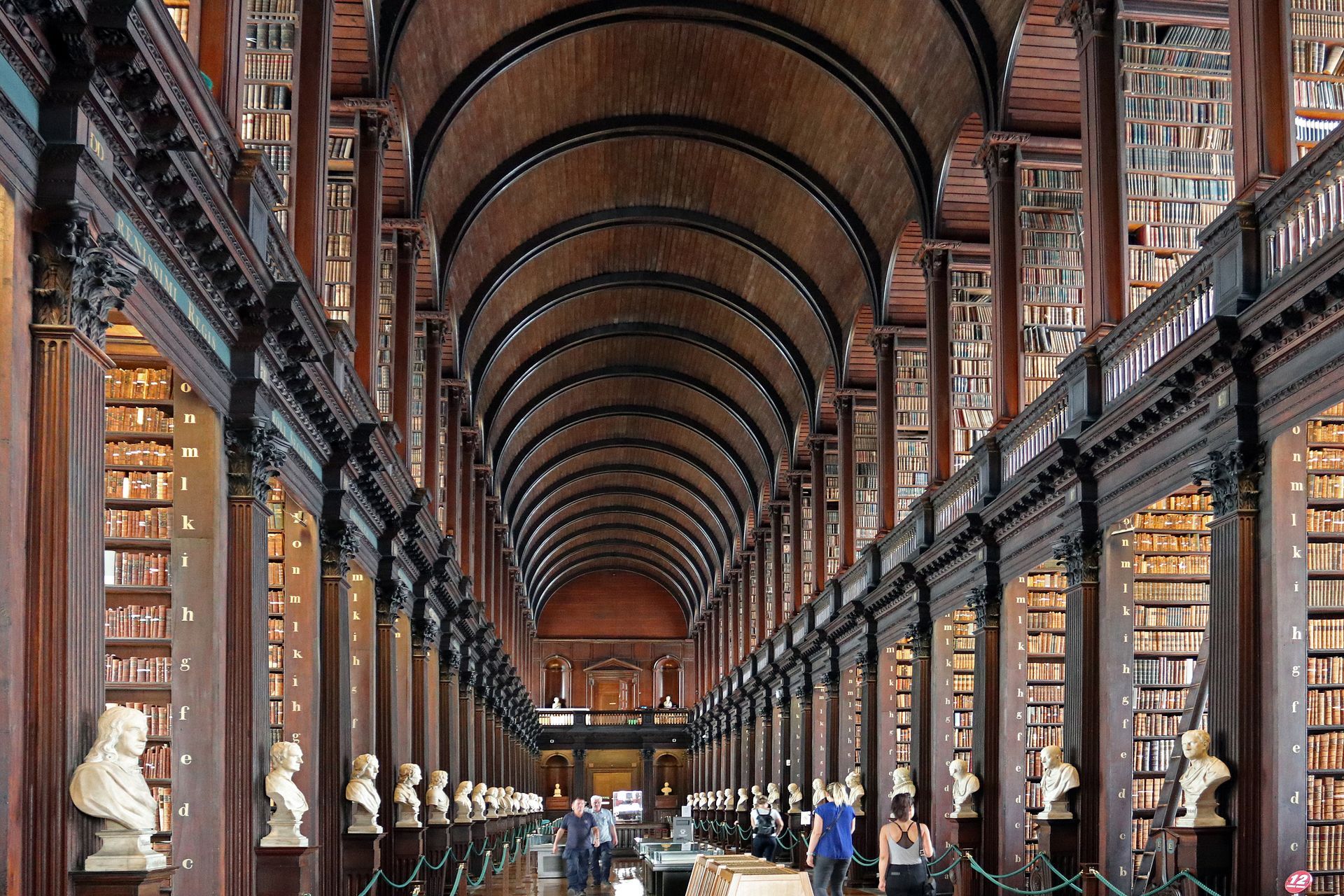 The inside of a library with a very long hallway