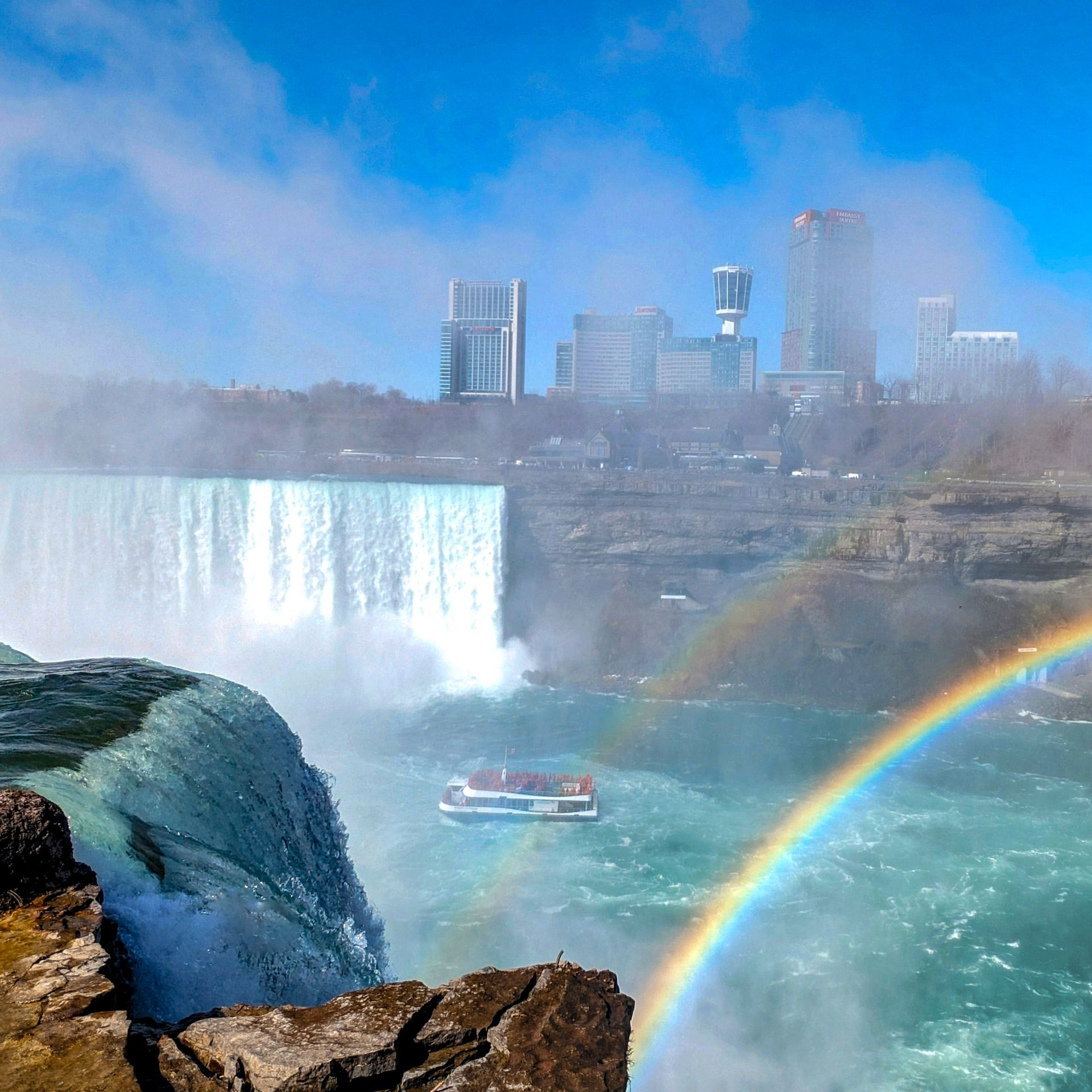 A waterfall with a rainbow in the water