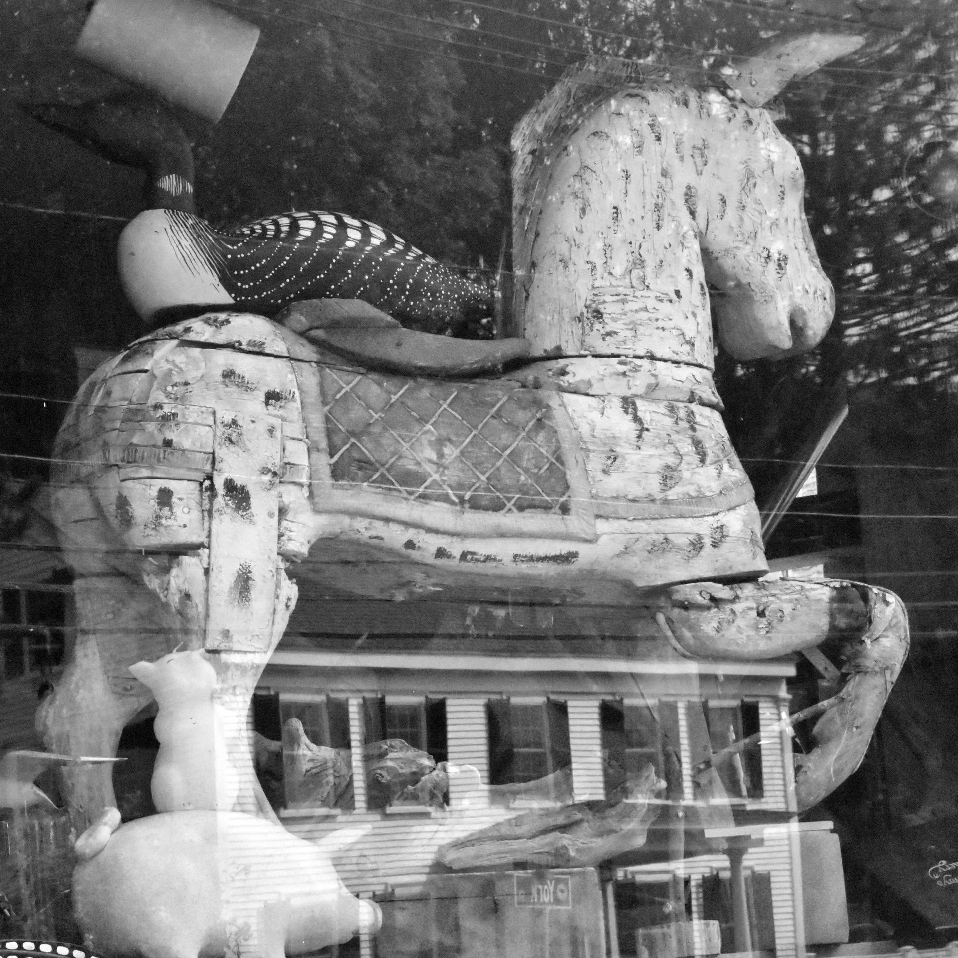 A black and white photo of a rocking horse