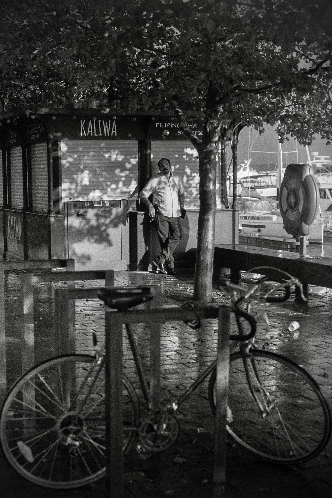 A bicycle is parked in front of a building that says sauna