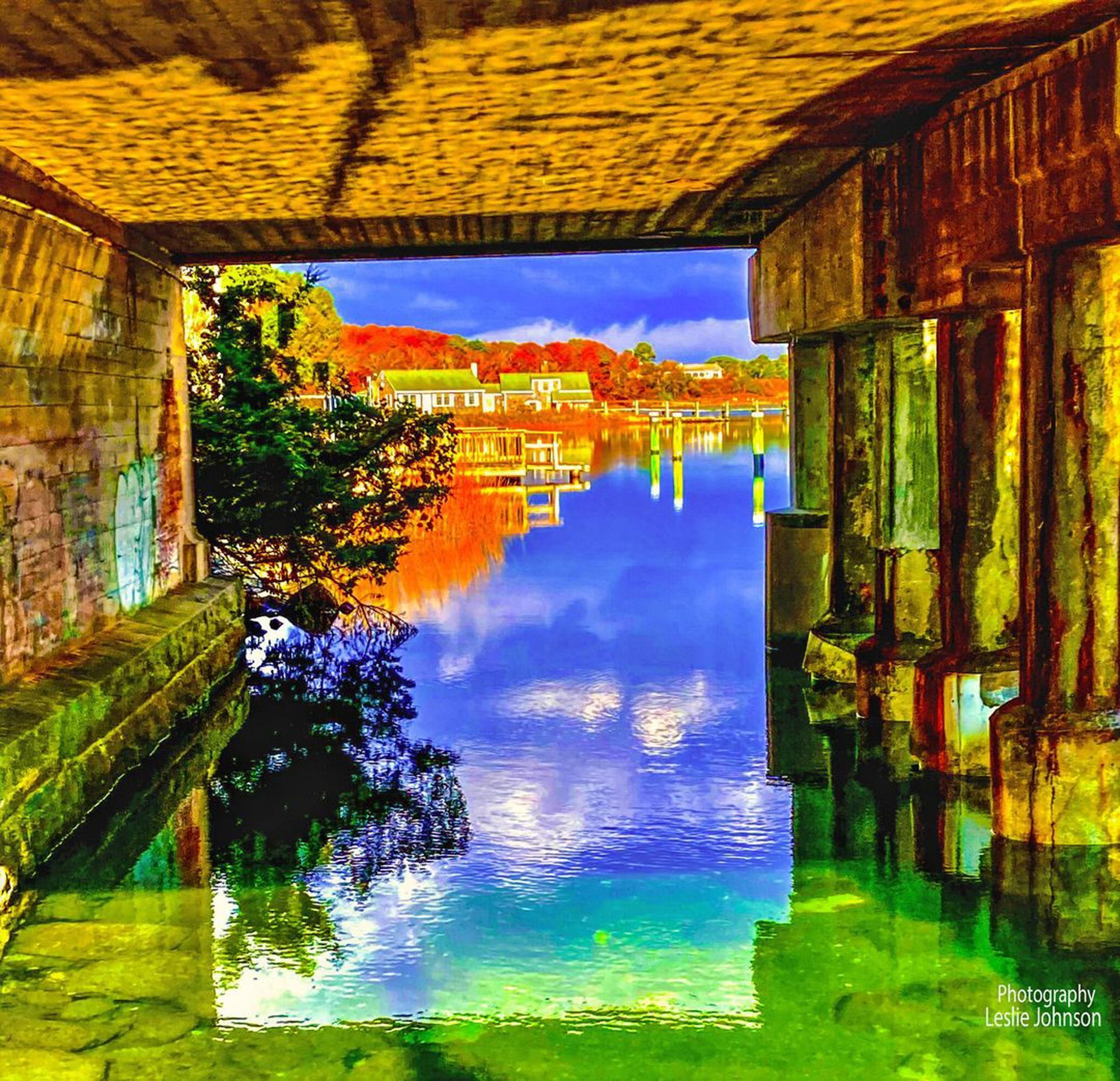 a painting of a bridge over a body of water