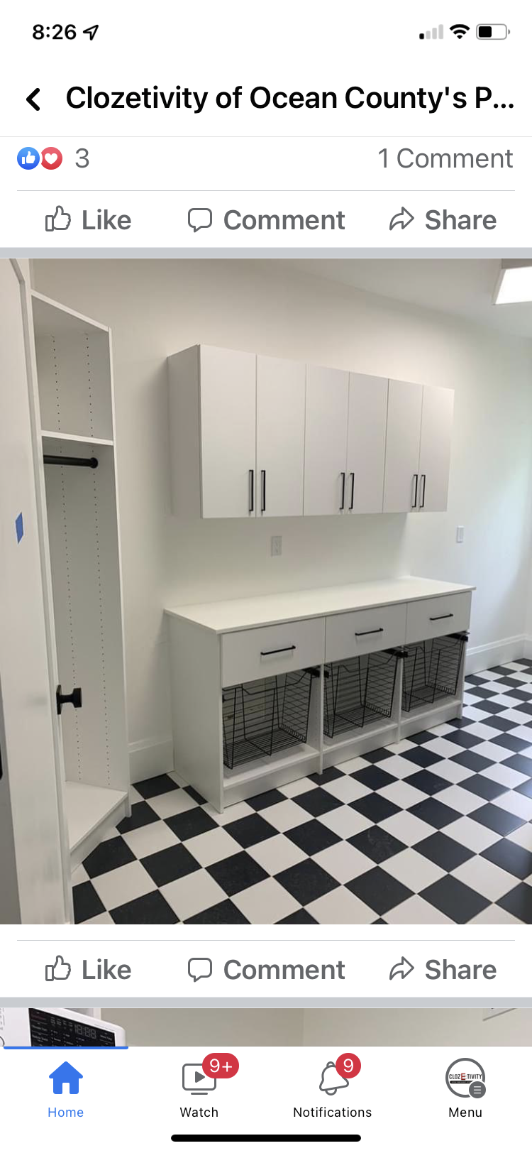 White cabinets and storage unit, checkered floor, white walls, interior room.