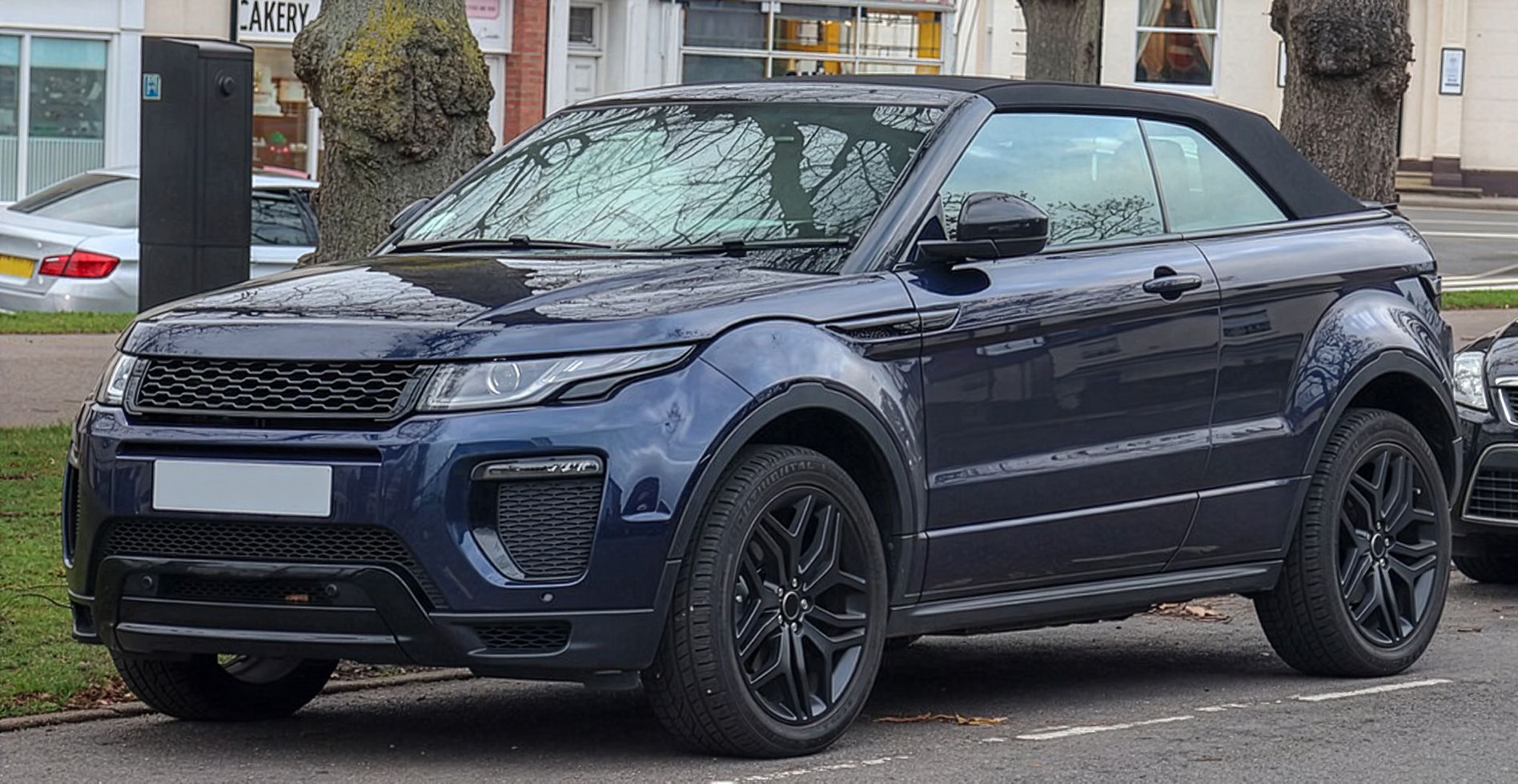 2018 Range Rover Evoque White car driving on the road | Euro Auto Tech & Smog