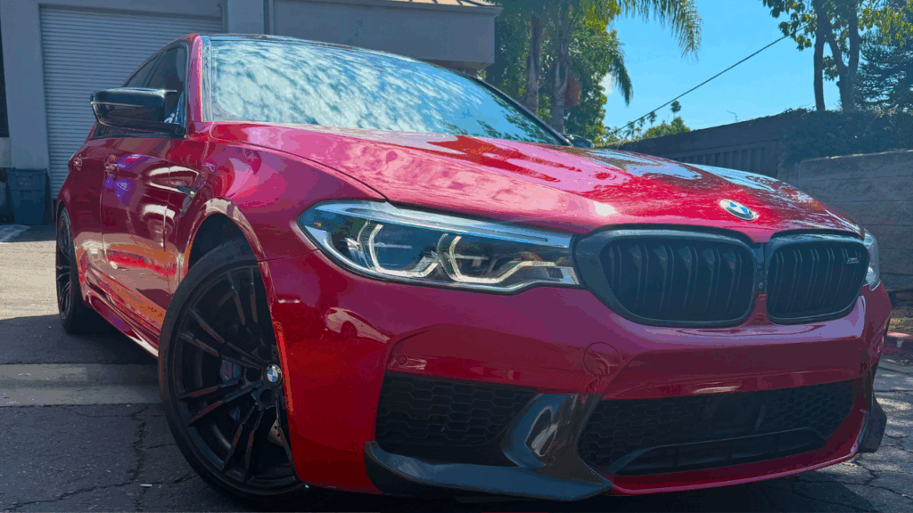 2019 BMW M5 red car parked outside of our shop | Euro Auto Tech & Smog