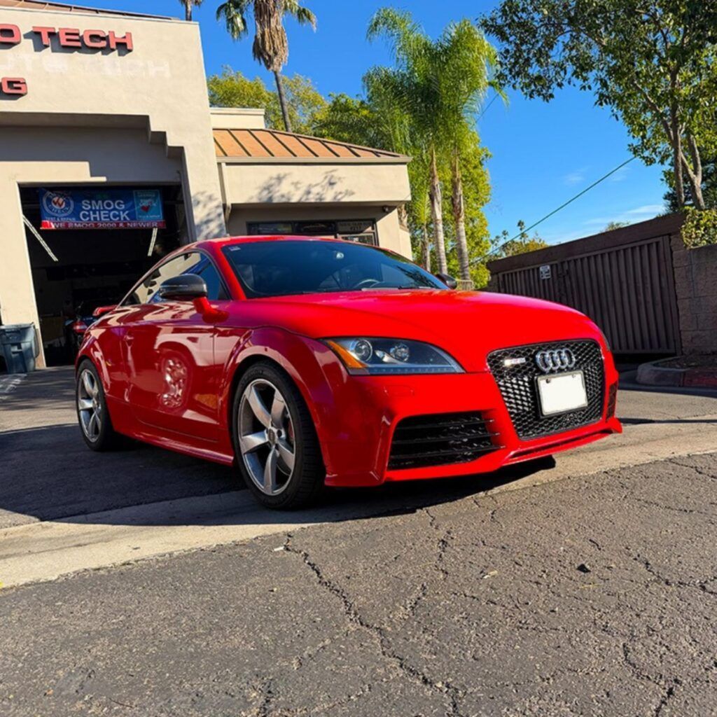 Red Audi TT RS parked outside of our shop | Euro Auto Tech & Smog